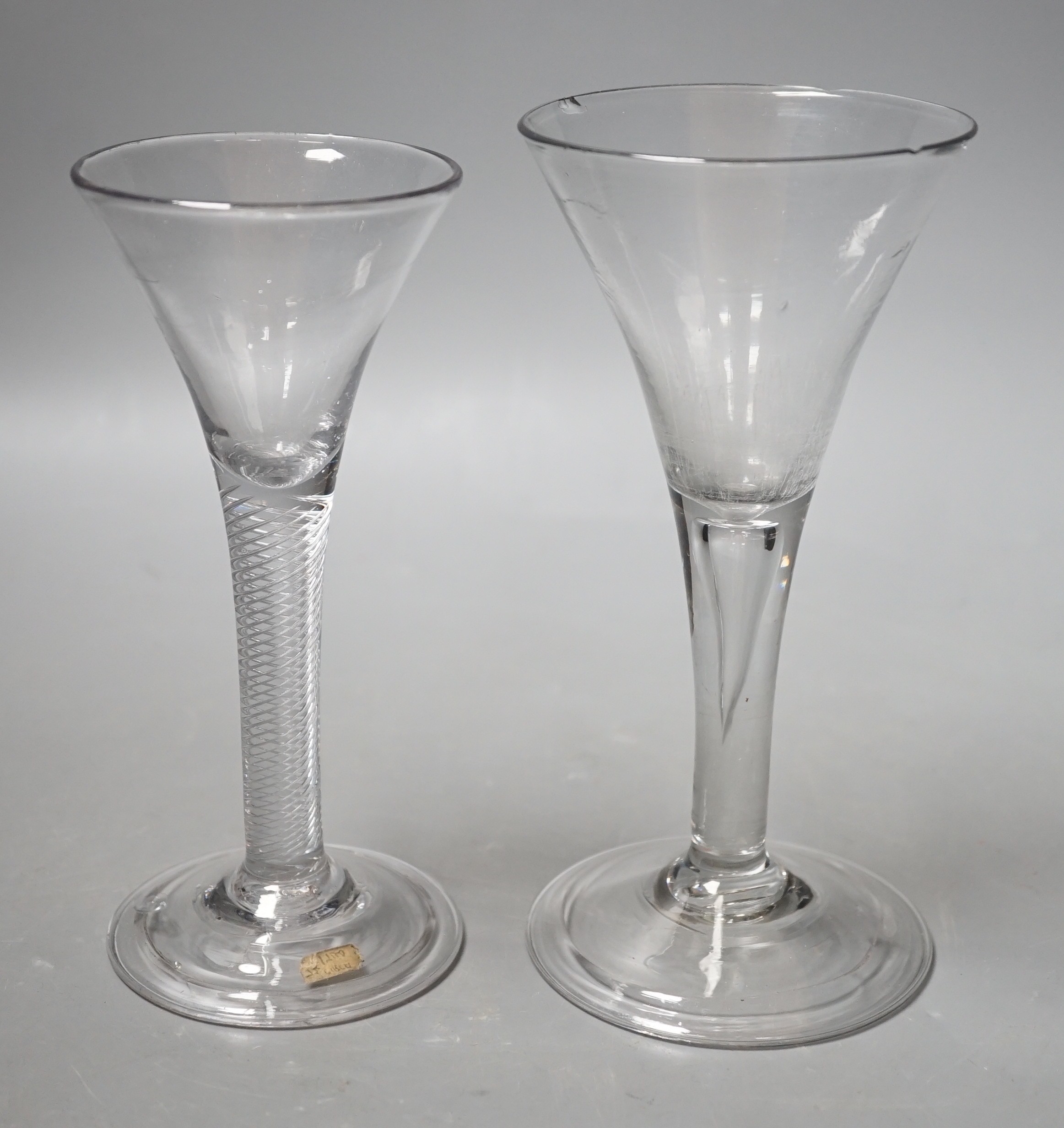 An 18th century airtwist stem wine glass, together with, another 18th century teardrop stem wine glass. Tallest 17.5cm